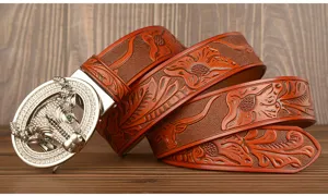 Close up detail of the carved brown leather men belt with sparkling rhinestone bull head buckle.