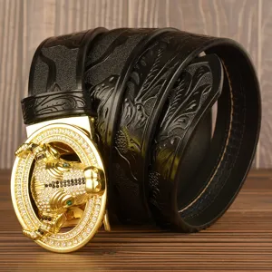 Men's black leather belt featuring gold bull head buckle and embossed pattern for casual wear.