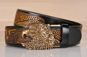 Detail view of vintage men leather belt featuring exquisite 3D eagle head buckle and embossed strap.