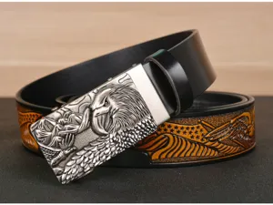 Detailed view of men's leather belt with eagle embossed automatic buckle and western strap.