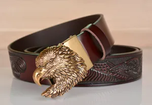 Vintage men's leather belt with detailed eagle head buckle and embossed strap design.