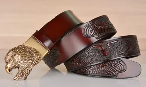 Detailed view of mens vintage cowhide leather belt with exquisite eagle head buckle and embossed.