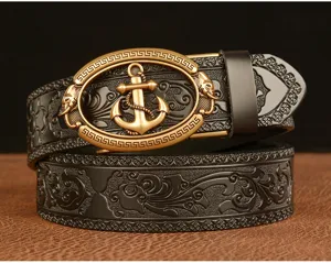 Detail view of the men's leather belt featuring a gold anchor buckle and embossed scroll design.