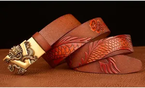 Detailed view of the embossed dragon leather belt with golden automatic buckle for men.