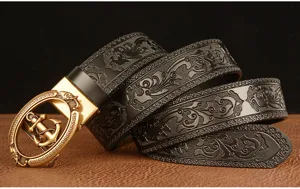 Detailed view of men's leather belt with gold anchor automatic buckle and floral embossed strap.