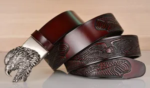 Men's vintage cowhide leather belt featuring a detailed metal eagle head buckle and embossed.