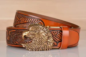 Men vintage cowhide leather belt with brass eagle head buckle and embossed eagle pattern strap.