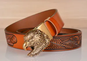 Vintage leather men belt featuring detailed antique brass eagle head buckle and stylish embossed strap.