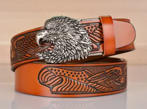Detailed view of the vintage cowhide men's belt featuring an embossed eagle head buckle and stylish pattern.