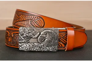 Detailed view of embossed cowhide men's belt with retro eagle metal automatic buckle.