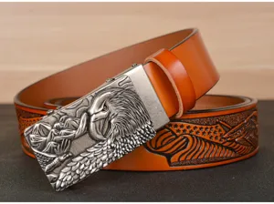 Detailed view of men leather belt with embossed eagle buckle and classic strap patterns.