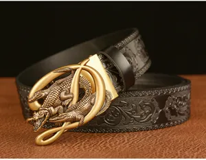 Detail view of vintage crocodile automatic buckle men's leather belt with embossed floral design.