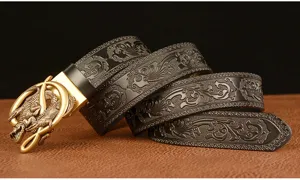 Detailed view of the retro crocodile automatic buckle carved leather men belt texture closeup.