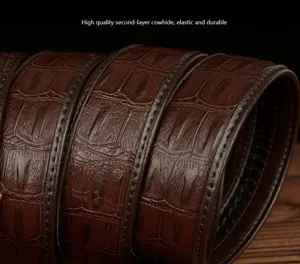 Detailed close-up view of a premium brown crocodile textured cowhide leather belt surface.