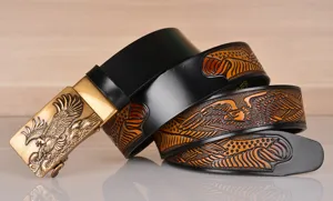 Men's embossed cowhide leather belt featuring majestic eagle automatic buckle detail view.