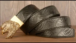 Detailed view of the retro men's black leather belt featuring a detailed golden eagle head buckle.