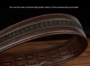 Detailed view of men's leather belt strap with textured crocodile grain and rubber card slot.