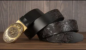 Men's black leather belt with embossed dragon pattern and golden automatic buckle detail.