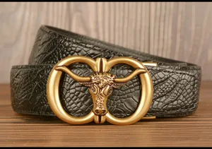 Detailed view of men's leather belt featuring a vintage gold bull head automatic buckle.