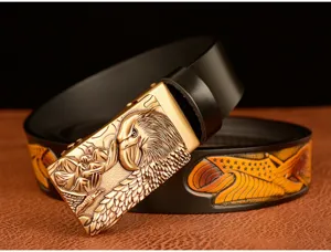 Men's leather belt with eagle head automatic metal buckle and embossed strap design.