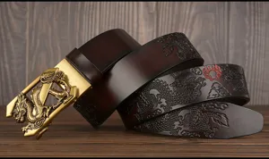 Detailed closeup of the men's leather belt featuring embossed dragon and gold buckle.