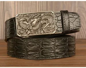 Detail view of mens black leather belt featuring crocodile texture and metal dragon buckle.
