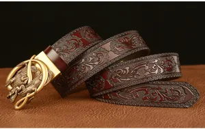 Close-up detail of retro men's embossed cowhide leather belt with stylish golden crocodile buckle.