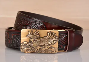 Detailed view of the men's leather belt featuring a brass eagle automatic metal buckle.