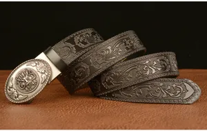 Embossed dragon buckle leather belt detail view showcasing intricate vintage floral patterns and hardware.
