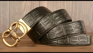 Detailed view of the men's automatic buckle leather belt featuring a classic bull head.