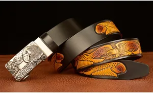 Men genuine cowhide leather belt detail with metallic eagle buckle and embossed eagle pattern.