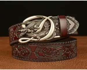 Men's retro carved leather belt detailed close-up, premium embossed cowhide and metallic crocodile buckle.