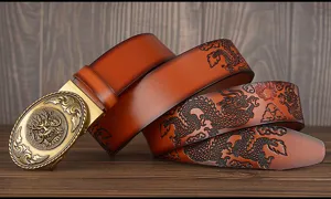 Close-up detail of men embossed dragon leather belt with vintage brass automatic buckle.