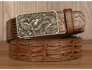 Close-up detail of the men's leather belt featuring a detailed Chinese dragon metal automatic buckle.