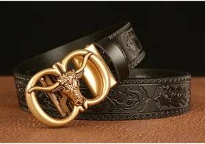 Detailed view of men's embossed leather belt featuring an intricate 3D bull head buckle.