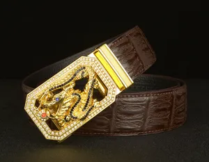 Men's automatic leather belt featuring a golden rhinestone dragon buckle and brown cowhide strap.