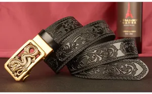 Detailed view of men leather belt featuring embossed scroll pattern and golden dragon buckle.