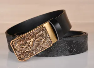 Men's leather automatic buckle belt with embossed dragon pattern for stylish jeans wear.