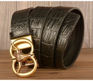 Detailed view of men retro crocodile pattern cowhide leather belt with gold bull head buckle.