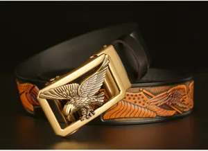 Premium leather belt with striking eagle buckle and detailed carved strap, ideal for casual jeans.