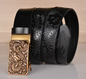 Detail view of men's leather belt featuring a golden embossed dragon automatic buckle and black strap.