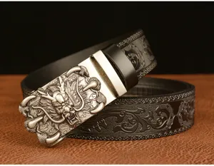 Close-up of retro dragon claw automatic buckle men's leather belt with carved strap details.