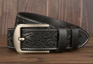 Men's vintage embossed leather belt with metal buckle, casual carved strap for jeans and trousers.