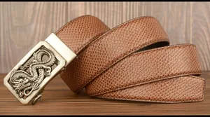 Close-up detail of retro dragon automatic buckle men leather belt featuring reptile texture.