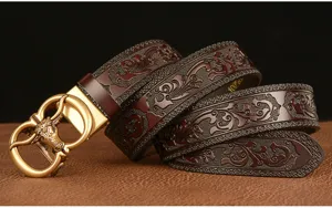 Detailed close-up of men's embossed leather belt with stylish bull buckle and patterns.