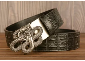 Detail shot of men's genuine leather belt featuring embossed crocodile texture and metal cobra buckle.