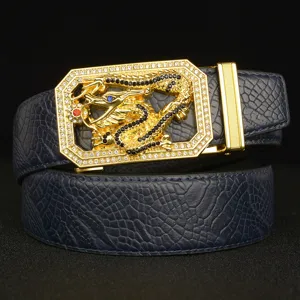 Close-up detail shot of luxury men rhinestone dragon buckle and textured leather belt body.