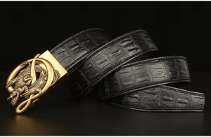 Detail shot of men black leather belt with embossed crocodile pattern and gold buckle.