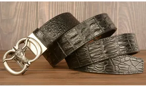 Detailed view of the black crocodile pattern cowhide leather belt with retro bull head buckle.