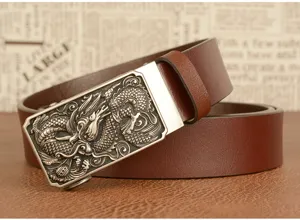 Detailed view of a mens brown leather belt featuring an intricate embossed dragon buckle.